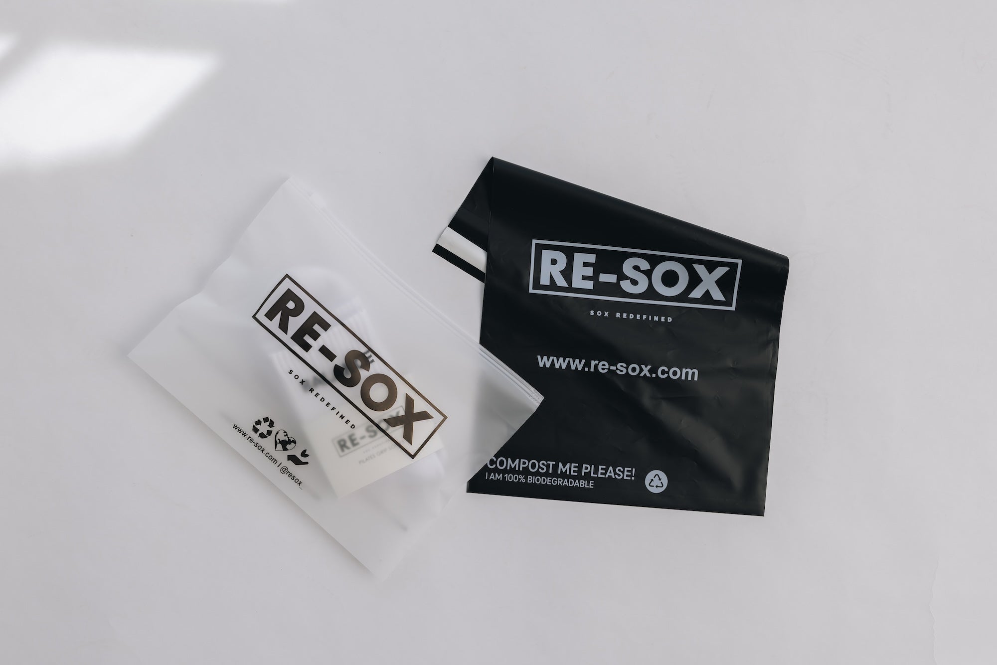 Two RE- SOX packaging on a white background