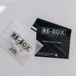 Two RE- SOX packaging on a white background